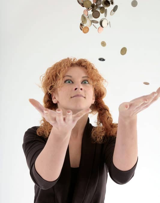 Woman juggling gold coins Abundance money mastermind starts june 2022